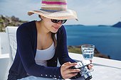 Young woman looking at camera, Santorini, Cyclades, Greece