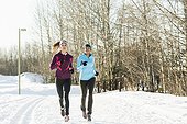 View of women jogging in winter