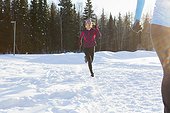 View of women jogging in winter