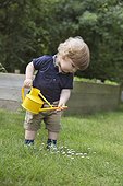 Boy with watering can