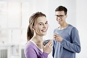 Berlin, Germany, Young woman enjoying coffee with her husband
