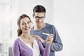 Berlin, Germany, Young couple with pregnancy test