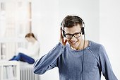 Berlin, Germany, Young man wearing headphones