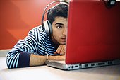 Young Man Listening to Music on Headphones