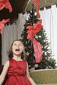 Girl Throwing Wrapping Paper
