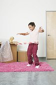 Girl Playing with Hoop in New Bedroom