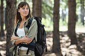 Young woman hiking in forest
