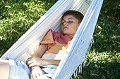 Boy relaxing in hammock
