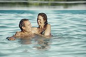 Couple enjoying in swimming pool