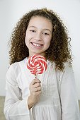 Mixed race girl with oversized lollipop