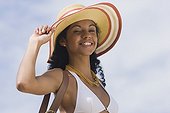 African woman in bikini and sunhat