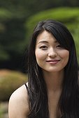 Confident Japanese woman smiling