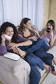 Multi-generational women using different phones