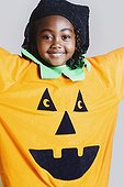 African girl wearing pumpkin costume