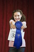 Mixed race girl competing in spelling bee