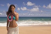 Pacific Islander woman laughing at beach