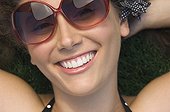 Close up of Hispanic woman wearing sunglasses