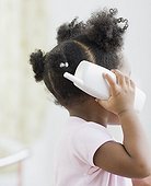 African American girl playing with toy phone