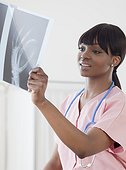 African nurse looking at hand x-ray