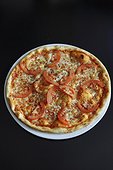 Gourmet pizza with tomatoes