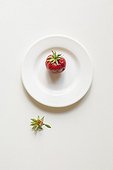 Strawberry on white plate