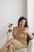 Portrait of smiling woman with cocktail