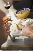 Hand cutting cheese