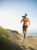 Woman training on coast - USA, California, San Diego