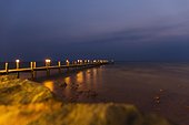 View of sea and pier at night,  Kep, Cambodia