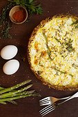 Quiche with ingredients of eggs, asparagus, paprika and thyme