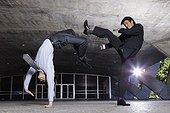 Two Businessmen Practicing Martial Arts