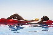 Woman Relaxing in Pool