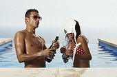 Couple Enjoying Champagne in the Pool
