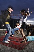 Young People Dancing at a Rooftop Party