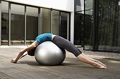 Woman Stretching on an Exercise Ball
