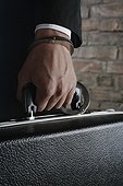 Briefcase Handcuffed to Businessman's Wrist