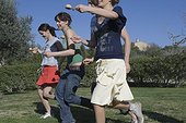 Young People Playing Egg and Spoon Race