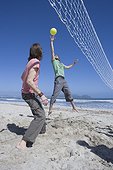 Two Men Playing Beach Volleyball