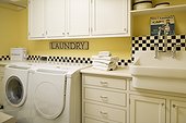 White Appliances and Cabinetry in Laundry Room