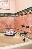Pink and Green Tile Surrounding Bathtub