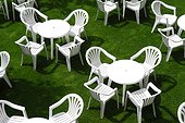 White Plastic Tables and Chairs on Lawn