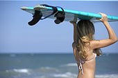Teenage Girl with Surfboard