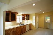 A Newly Renovated Kitchen Lit from Above with Spotlights