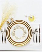 Elegant Holiday Table Setting with Cream and Gold Motif