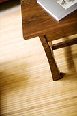 Wooden coffee table on beadboard mat