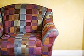 Armchair with multi-colored geometric print