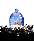 A snowglobe containing Santa Claus and a snowman for holiday decorating