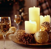 Warm Candles and Pinecones Highlight a Festive Centerpiece