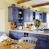 Blue Cabinets Enliven a Kitchen Decorated in Provincial Style