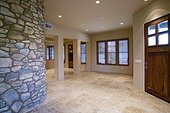 Front Door into Living Room with Stone Wall